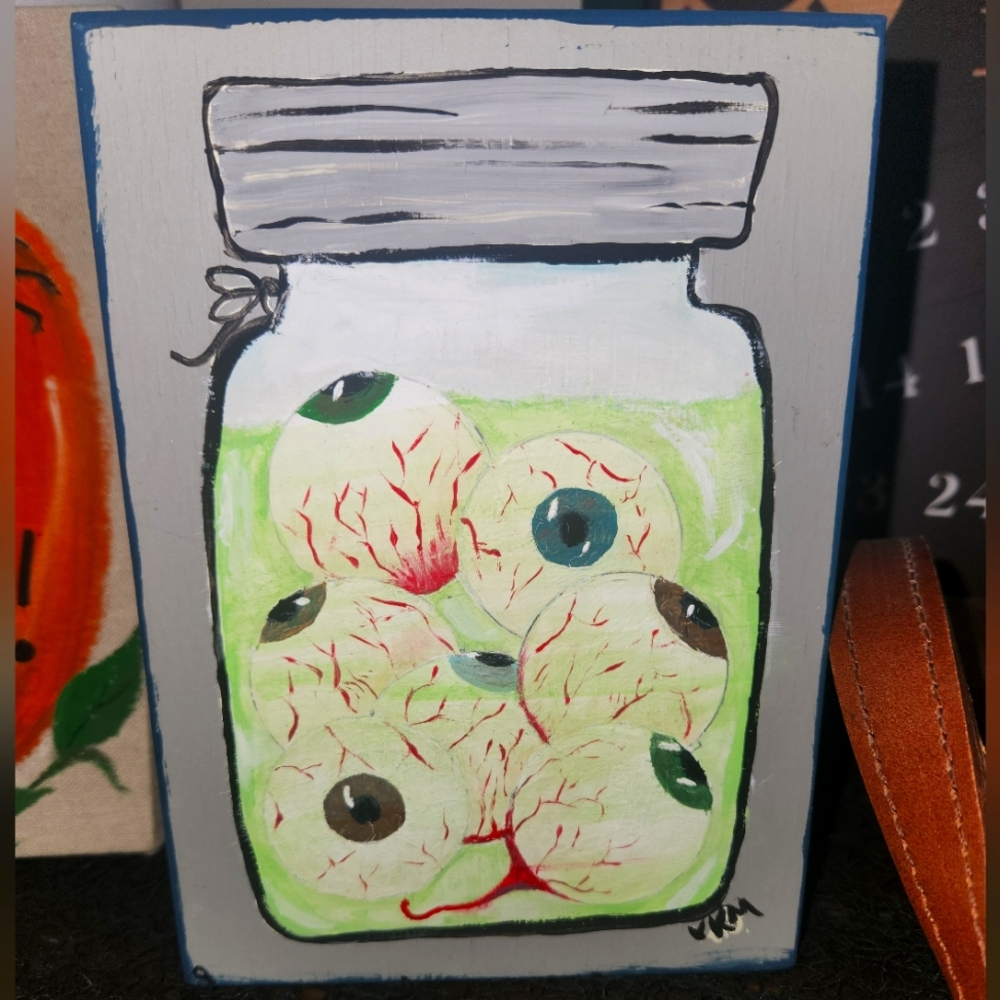 Hand painted thrifted spooky art.